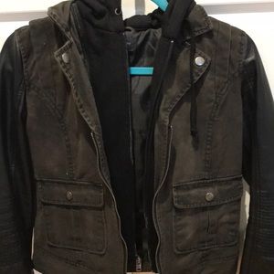 Dark green jacket with leather sleeves.
